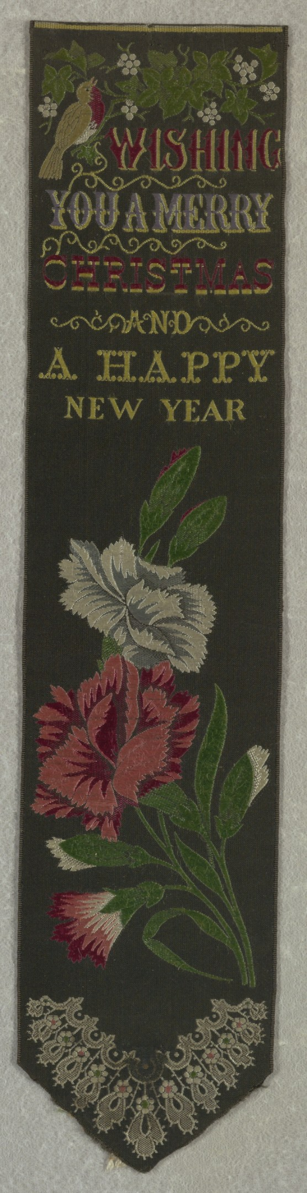 Schwarze Flagge mit roter und wei├čer Blumenstickerei und dem Text "Frohe Weihnachten und ein gutes neues Jahr" umgeben von bunten Blumen und Bl├Ąttern.
